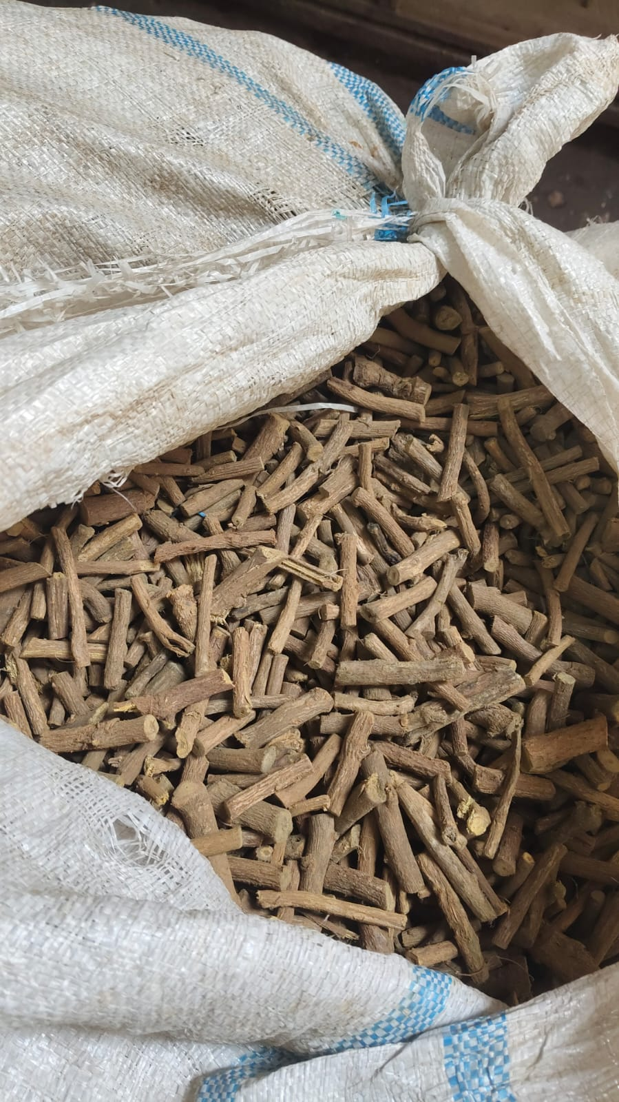 Mulethi dry roots in bulk bag - close up view